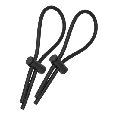 a pair of black ear buds on a black background